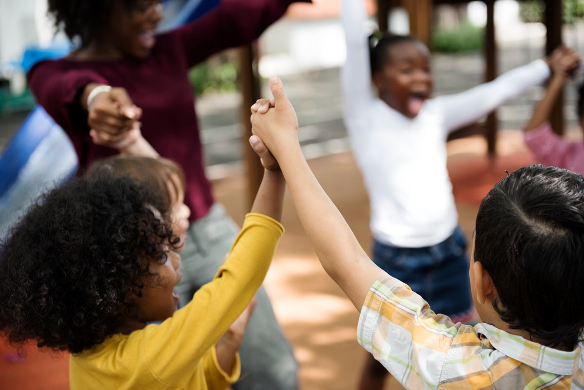 Kids Smiling Holding Hands